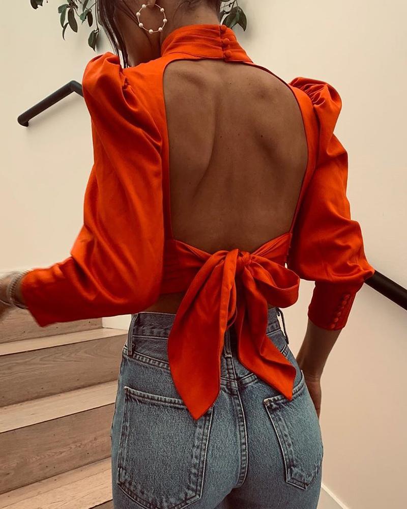 

Knotted Backless High Neck Blouse